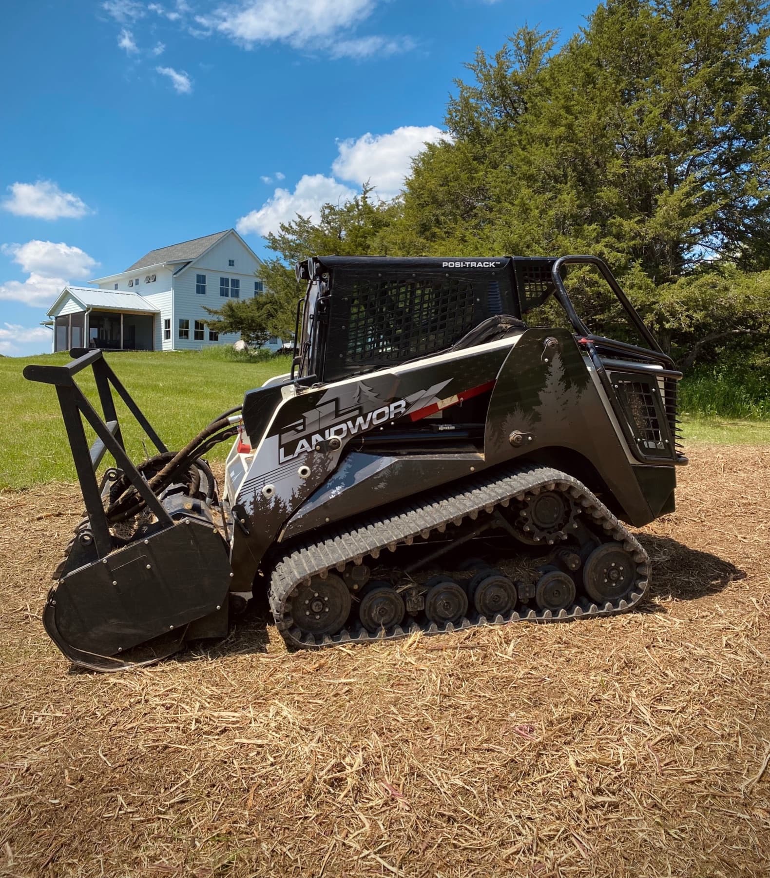JL Landworx forestry mulcher staged on a cleared residential property